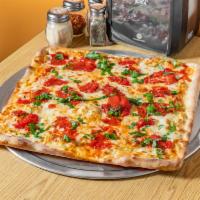 Classic Grandma Square Pizza · Mozzarella cheese, plum tomatoes, garlic, and fresh basil.