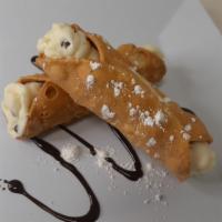 Cannoli · Served with cannoli cream, sugar glass and a cherry.