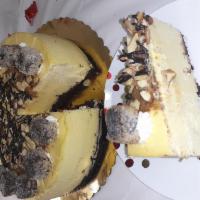 Brownie delight cheesecake · A brownie bottom topped with a creamy french vanilla cheesecake. Filled with almonds, ganach...
