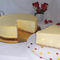 New York cheesecake · A rich and dense cheesecake exploding with vanilla flavor sitting on a traditional buttery g...
