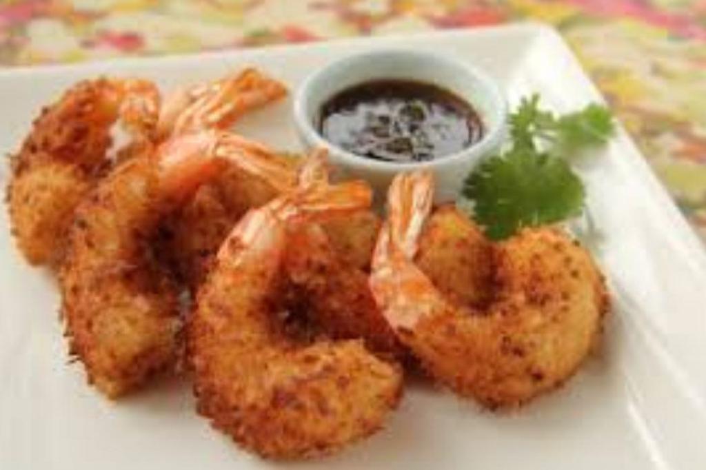 Coconut Shrimp · 4 pieces. Fried and rolled in coconut. Served with a sweet chili dipping sauce.