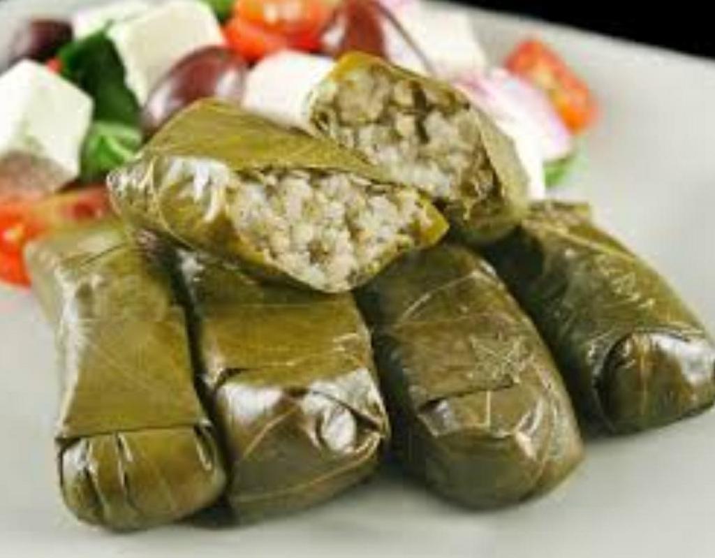 Stuffed Grape Leaves · 6 pieces. Served with feta, cheese, lettuce and tomato.