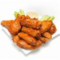 Buffalo Wings · 7 pieces. Cooked wing of a chicken coated in sauce or seasoning. Served with blue cheese dre...