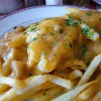 Disco French Fries · French fries with melted cheese and brown gravy.
