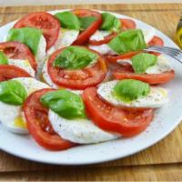 Fresh Mozzarella Caprese · Served with roasted pepper, tomato and basil in extra virgin olive oil.