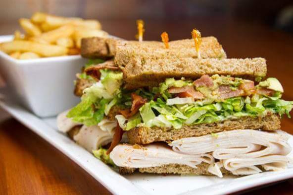 1. Turkey Triple Decker Club · 4 slices of bread with 3 layers of turkey filling. Served with bacon, lettuce, and tomato.