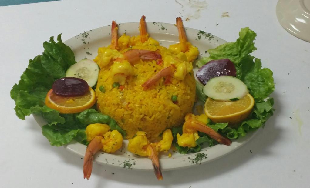 54. Rice with Shrimp · Served with salad and french fries.