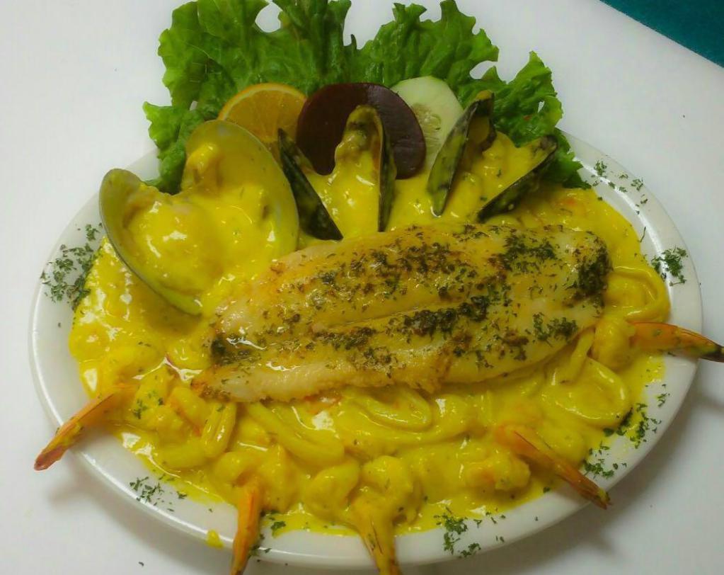 56. Fish Fillet with Seafood · Served with rice, french fries and salad.