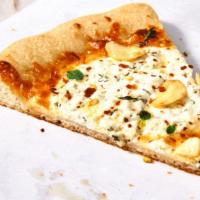 White Pizza Slice · A sauce less pie topped with ricotta, mozzarella, and Parmesan cheese.