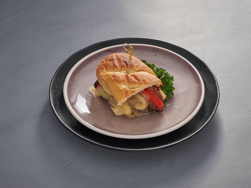 Philly Cheesesteak · toasted french sub, roast beef with sauteed pepper and onion with provolone cheese
