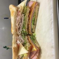Club Pounder · tripple toasted sourdow bread ham and turkey cheddar and swiss lettes tomato and mayo