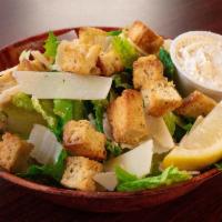 Caesar Salad · Romaine, Parmesan, croutons, and lemon wedges.