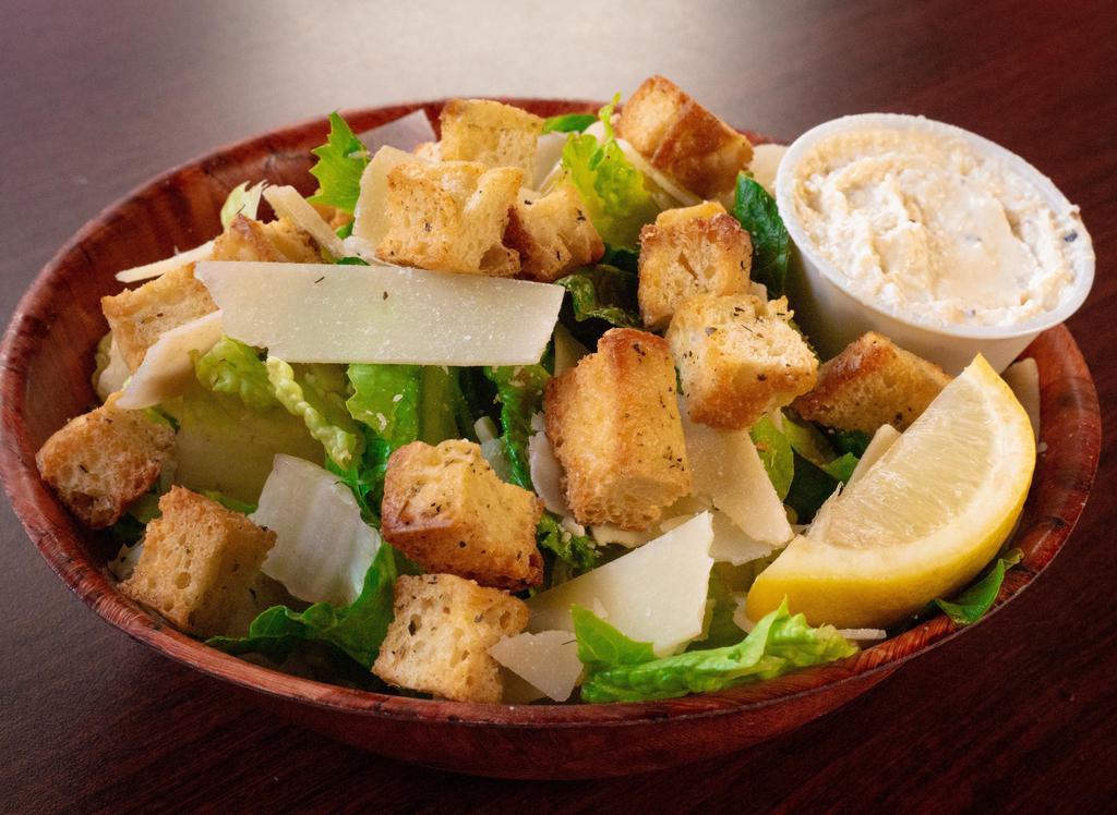 Caesar Salad · Romaine, Parmesan, croutons, and lemon wedges.