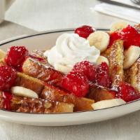 Strawberry Banana French Toast · Our original thick-cut French toast topped with glazed strawberries & fresh banana slices, d...