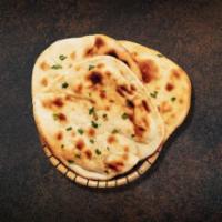 Butter Naan Fiesta · Fresh made flatbread, baked in a traditional clay oven, brushed with butter.
