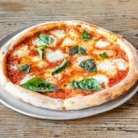 Margherita Pizza · Tomato sauce, fresh mozzarella, basil and extra virgin olive oil