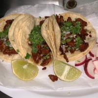 Tacos de Carne enchilada · Beef marinated in red chile sauce