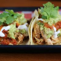 GH Spicy Chicken Tacos (2) · Pulled Ancho Chicken, Guacamole, Salsa Roja, Sour Cream, Lime