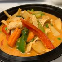 Red Curry · Red curry paste with coconut milk, bambu shoots, bell peppers, carrots and Thai basils. Spicy.
