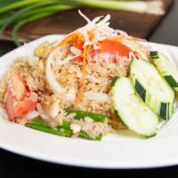 Thai Fried Rice · Stir fried rice with white onions, tomatoes, scallions, and egg.