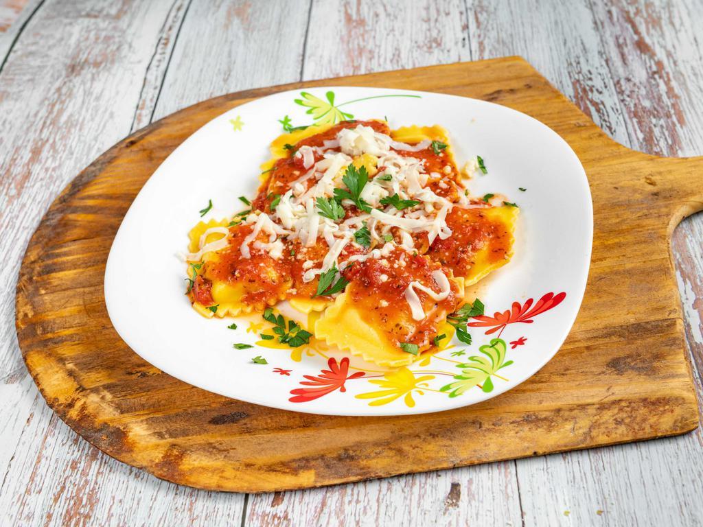 Cheese Ravioli · 8 PC BAKED WITH TOMTAO SAUCE AND MOZZARELLA CHEESE 
SERVED WITH BREAD 