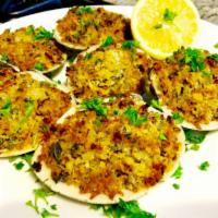 Baked Clams (1/2 dozen) · Minced clams mixed with butter, onions, parsley, and bread crumbs, spooned into half clam sh...