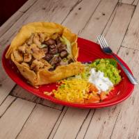Taco Salad · Crispy salad with ground beef or shredded chicken. Served within a crispy flour tortilla she...
