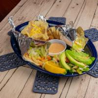 Fish Tacos · 2 flour tacos with grilled or fried fish fillets, cabbage and chipotle remoulade sauce.