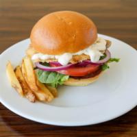 Fish Sandwich · Fried tilapia fillet, mixed greens, tomato, onion and tartar sauce.