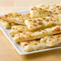 CHEESE STICKS · Fresh dough covered in garlic sauce and topped with mozzarella
