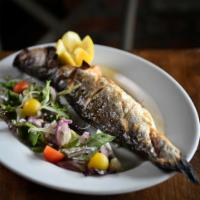 Whole Branzino · Mixed green salad, red onion, fennel, rosemary lemon drench, extra virgin olive oil.