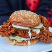 The Southern Sandwich · Crispy fried chicken, lettuce, tomatoes, homemade pickles, white Alabama BBQ sauce on potato...