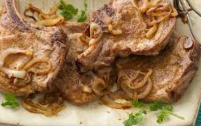 Chuletas Fritas · Pork chops fried.