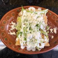 Quesadillas con pollo · Handmade Tortilla, with queso Oaxaca, chicken, lettuce, avocado slice, tomato slice, sour cr...