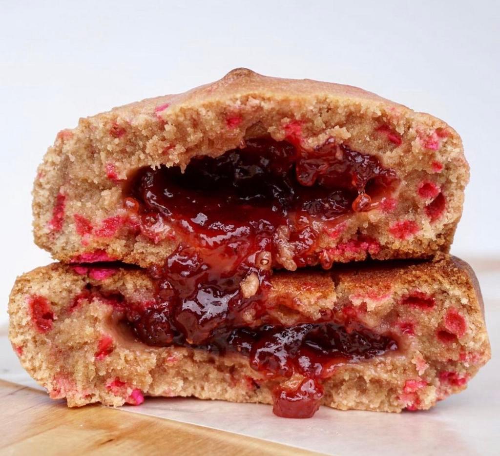 Strawberry PB&J Duchess Cookie · Delicious peanut butter cookie filled with strawberry jelly and topped with pink sprinkles.
