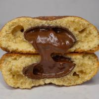 Churro Nutella Duchess Cookie · Snickerdoodle cookie stuffed with nutty and creamy Nutella.
