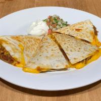 Quesadilla · 2 flour tortillas grilled with cheese, topped with sour cream and pico de gallo.