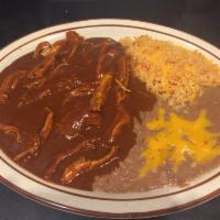 Mole Poblano · Chicken breast pieces in a housemade Puebla-style mole sauce. A touch of chocolate and spicy...