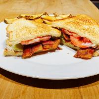 BLT Sandwich  · Served with french fries.