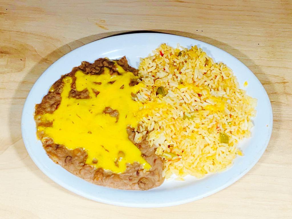 Rice & Beans · Spanish rice made with chicken stock. Refried pinto beans(vegetarian)