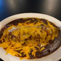 Enchilada · Single enchilada. Rolled tortilla ,choice of filling, topped with sauce and melted cheddar c...