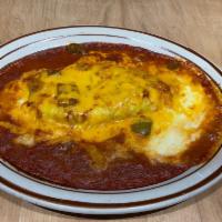 Chile Relleno · Roasted poblano pepper stuffed with Jack cheese.Topped with mild sauce and melted cheddar.