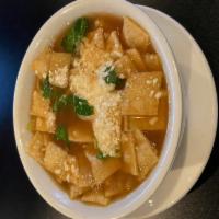 Tortilla Soup · House-made tortilla soup, served with chicken, fresh avocado and Cotija cheese.