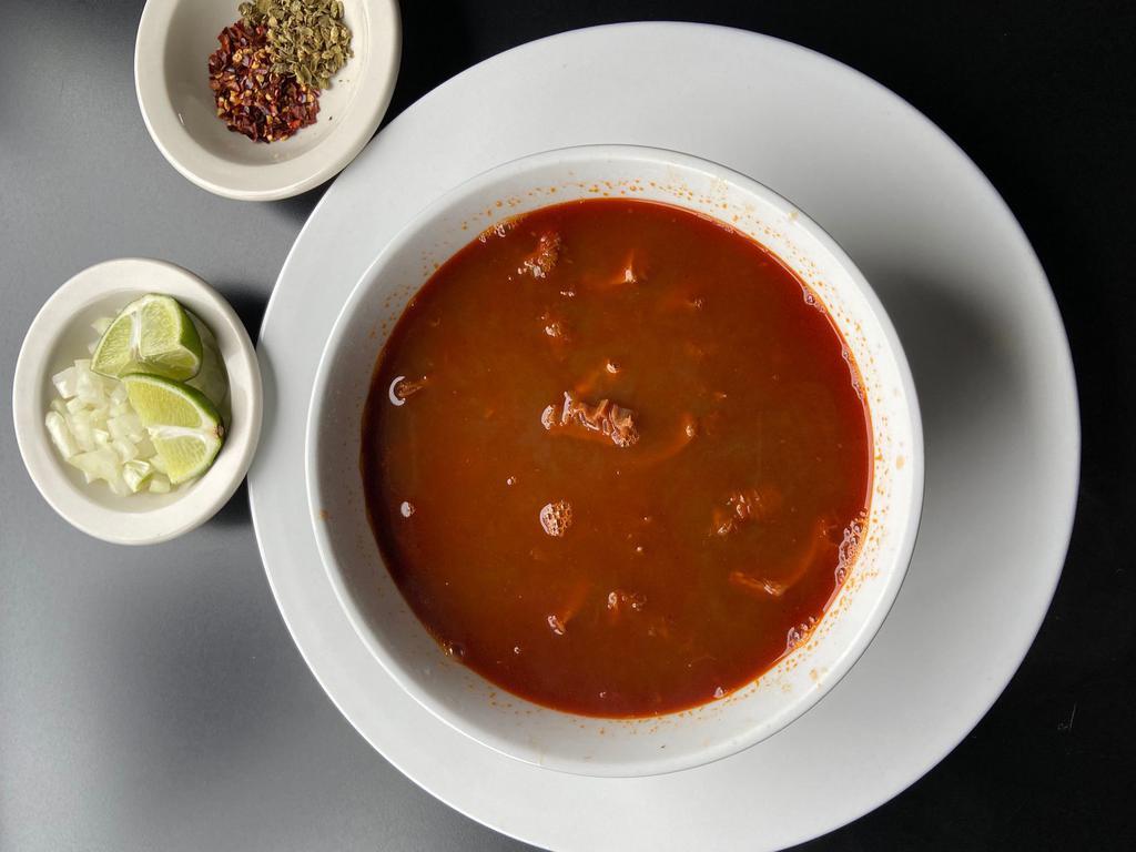 Menudo · Beef tripe in a spicy broth, served with all the fixings!