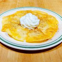 Sopapillas · Fried flour tortillas topped with honey and cinnamon.