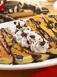 Oreo Cookie Crunch · Crushed Oreo cookies, cooked inside buttermilk pancakes, topped with cookie crumbles, chocolate syrup and extra whipped topping.