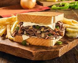 Famous Philly Cheese Steak Sandwich  · Seasoned beefsteak, grilled onions, grilled green peppers and loads of melted Swiss cheese on Texas toast or hoagie bun.