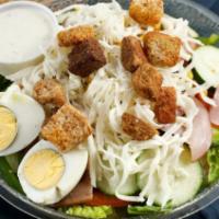 Cobb Salad · Lettuce, tomatoes, onion, cucumber, egg, ham, sweet corn, croutons, and mozzarella cheese.