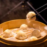 B1. 灌汤小笼包 Shanghai Soup Dumpling (6) · Savory soup with dumplings. 