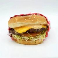 1/4 lb Cheeseburger · Dressed with 1000 Island, lettuce, onions, tomato, and pickle on a sesame seed bun.